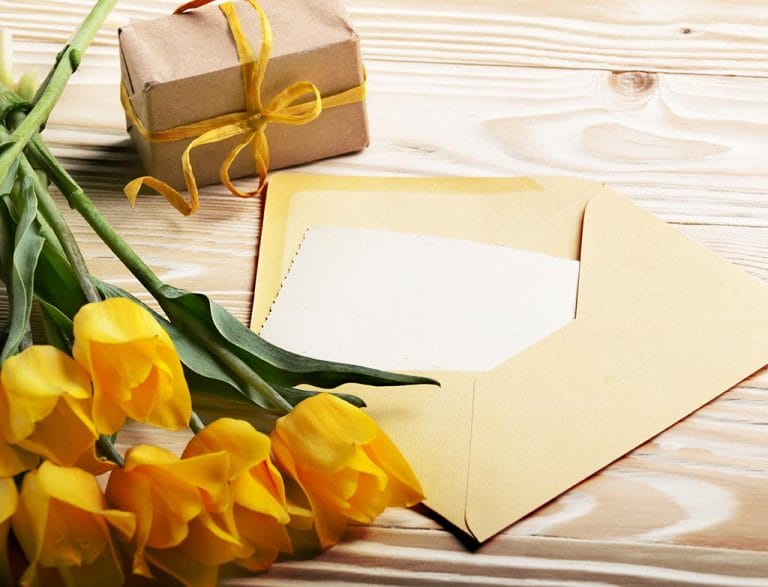 Yellow Tulips Near Blank Greeting Card Gift Box And Envelope On